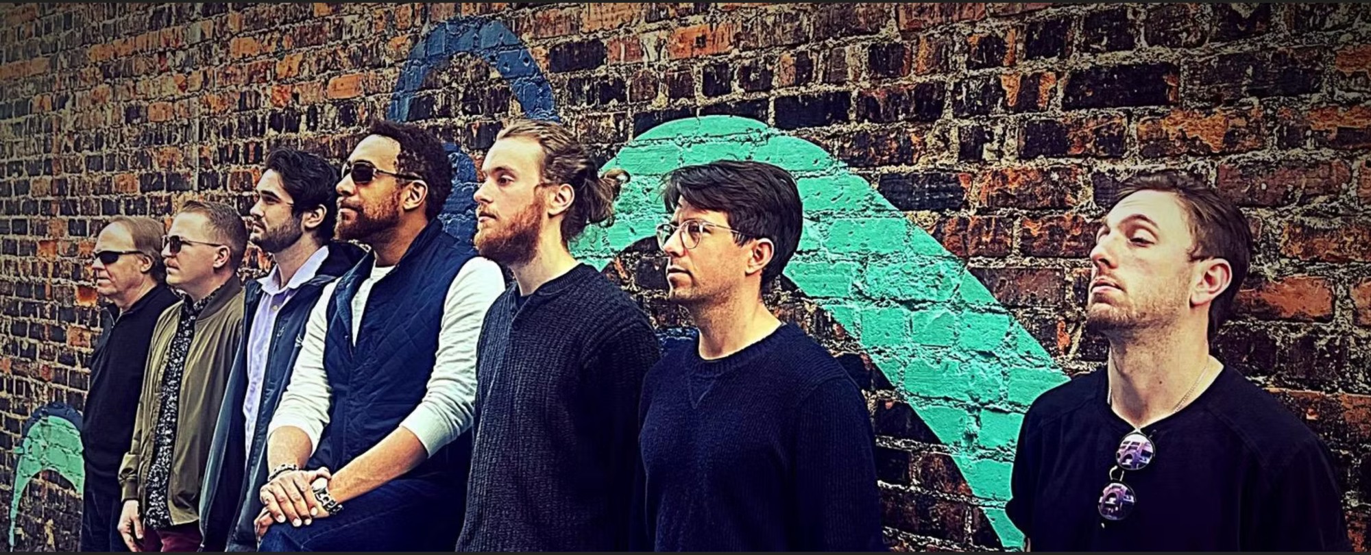 Against the wall